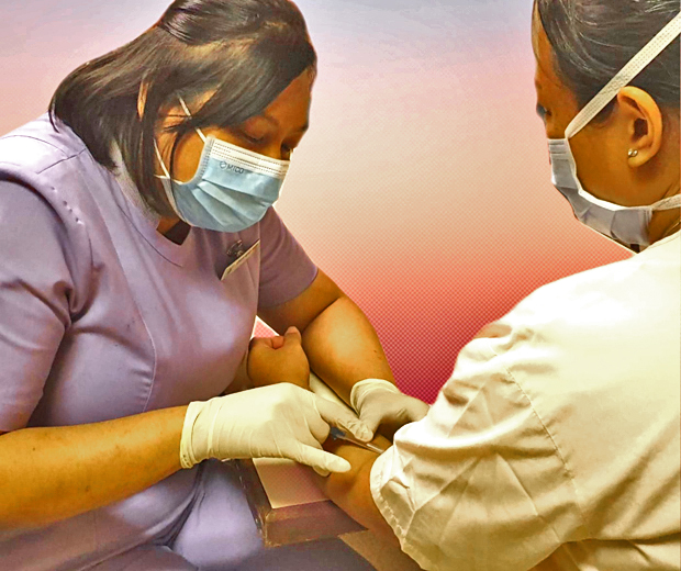  ​One
of Asnida’s duties as a Senior CSA is to draw blood for her patients. 