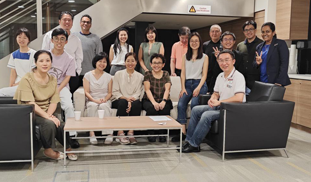  ​SSN Lwin Lwin San (center, seated) and her supervisor NC Ye Lizhen (left of Lwin Lwin) with SingHealth Toastmasters members 