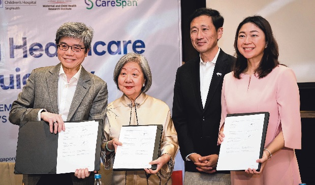  ​(From left) Professor Fabian Yap, deputy director of the SingHealth Duke-NUS Maternal and Child Health Research Institute; Ms Jennie Chua, chairman of Temasek Foundation’s health and education executive board; Health Minister Ong Ye Kung and Taguig City Mayor Lani Cayetano after the signing of the pact in Taguig City, Manila, on Aug 16. ST PHOTO GIN TAY  