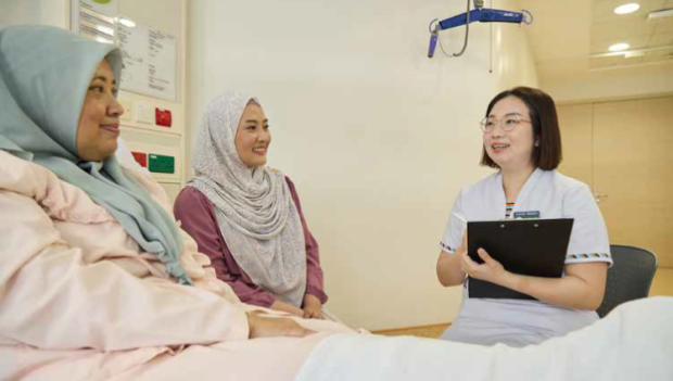 Seniors and caregivers associate frailty with physical condition, ageing and mental frailty, says Dr Lim Siew Hoon, who surveyed these respondents in the outpatient and bedside settings (staged here with colleagues, Senior Nurse Manager Kamsiah Jaafar as patient and Nursing Executive Ms Raden Nurheryany Sunari).  