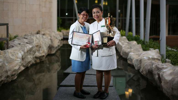  ​​Ms Nasah Sohor (R), 53, won the first prize for the Tan Chin Tuan Nursing Award - the highest local accolade for enrolled nurses, while Ms Sylvia Jani (L), 66, won the third prize on Tuesday, 22 Nov.  ST PHOTO ONG WEE JIN